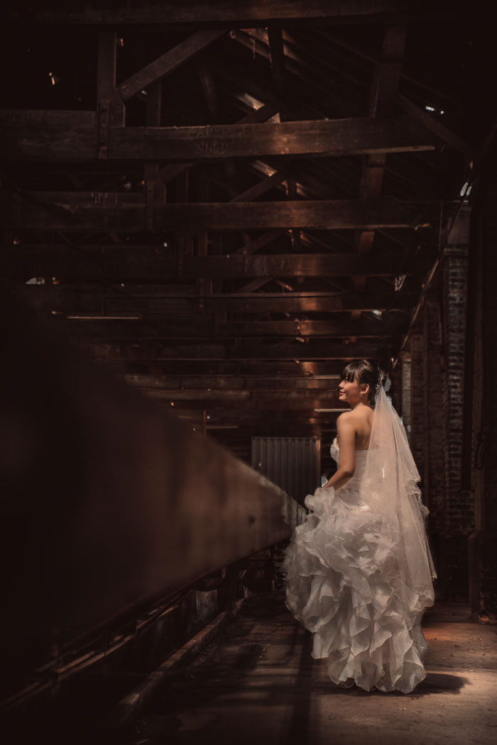 Ruffle bridal gown. Photography by Kennfoo Weddings