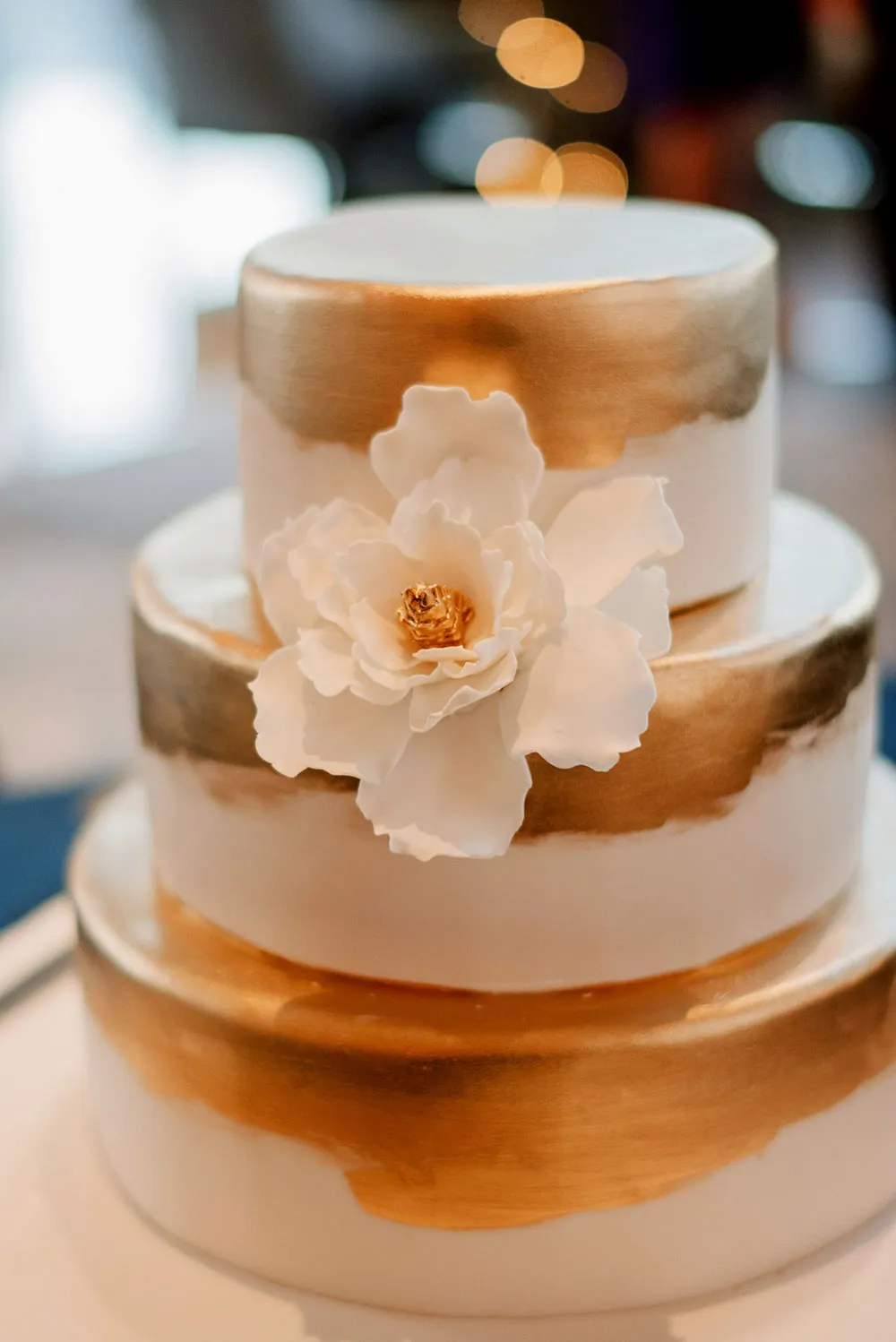 Gold wedding cake. Photo by Bloc Memoire Photography. theweddingnotebook.com