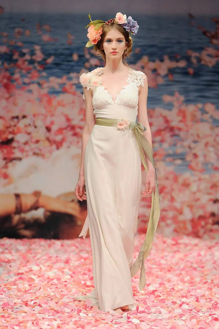 Claire Pettibone 2013 Fall Collection – Maiden. Ivory linen with guipure leaves and jeweled blossom shoulder with green ribbon waist sash. theweddingnotebook.com
