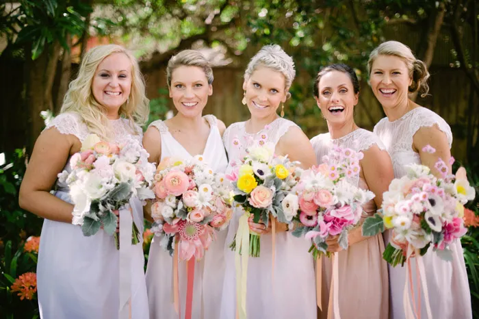 Bridesmaids in peach tones. Tealily Photography. theweddingnotebook.com